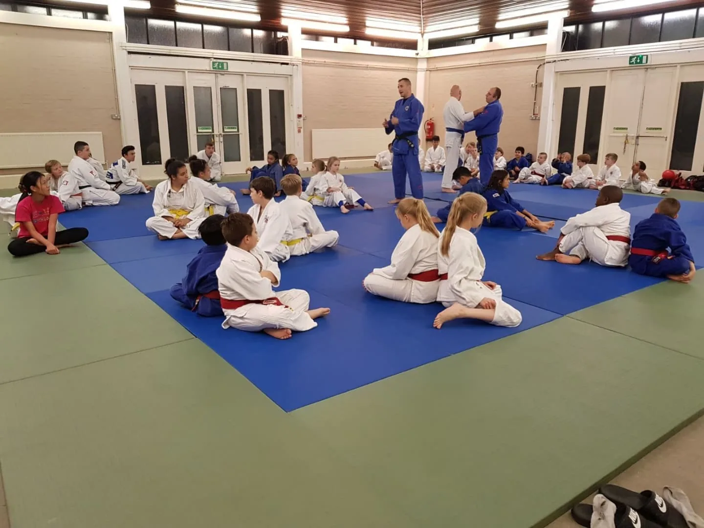 Children's class on the blue and red mats