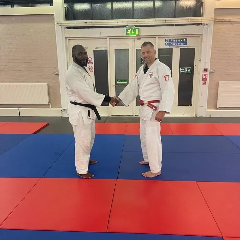 Two students promoted to black belt; they started on an NCMA beginners course in 2010
